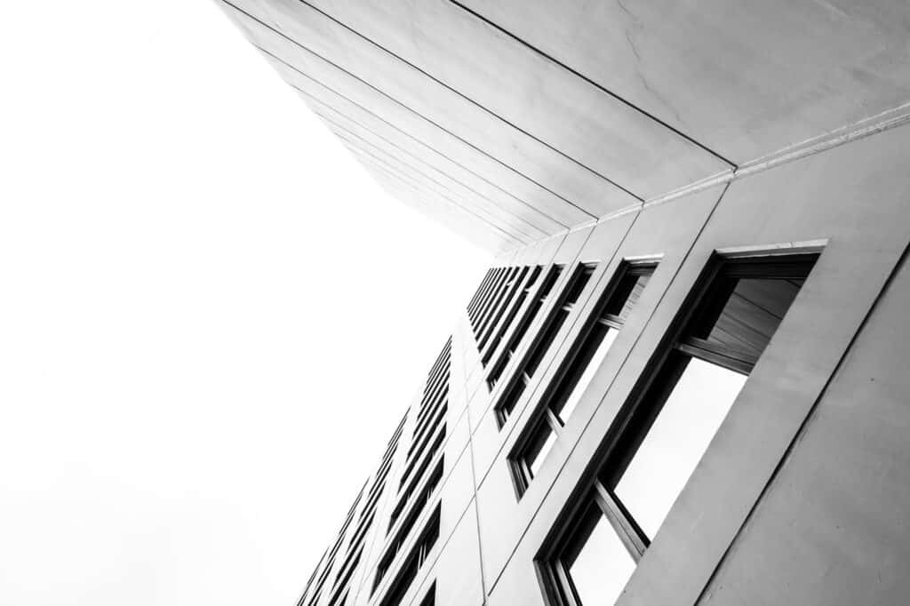 Office building facade with large windows and modern architecture.